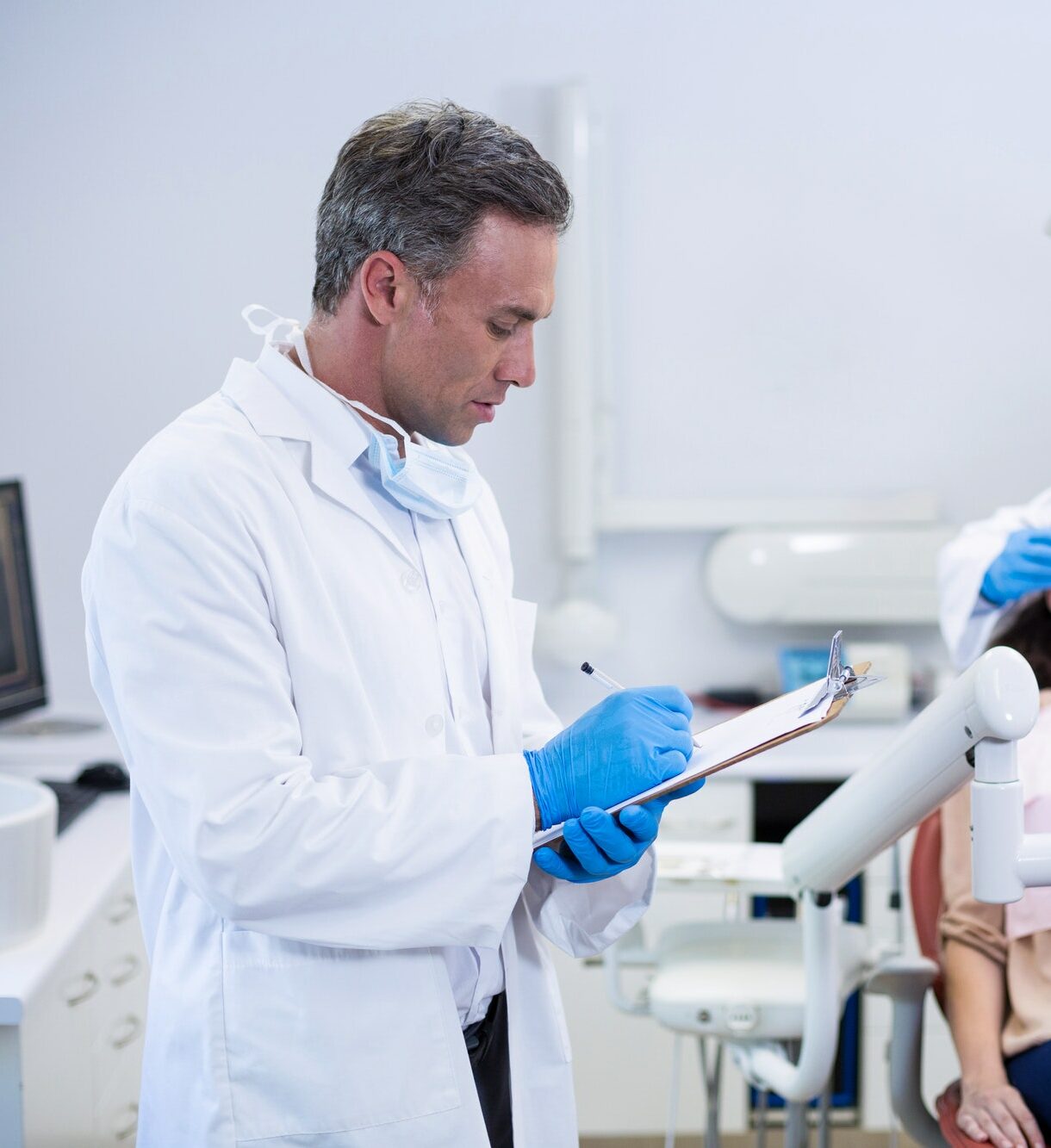dentist-writing-on-clipboard.jpg
